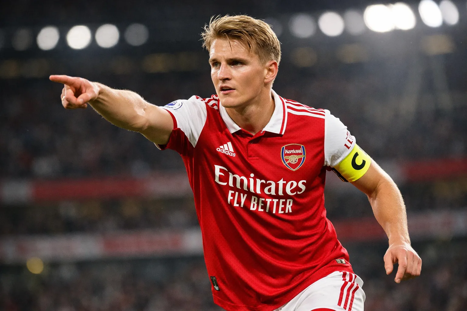 A highly detailed and recognizable representation of Martin Ødegaard, a technical midfielder and Arsenal captain, wearing the home kit and armband at the Emirates Stadium.