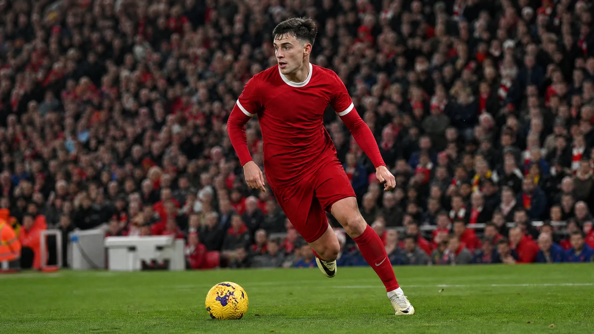 Curtis Jones driving forward for Liverpool in their red kit as Inter Milan's €20m transfer bid intensifies in the summer window