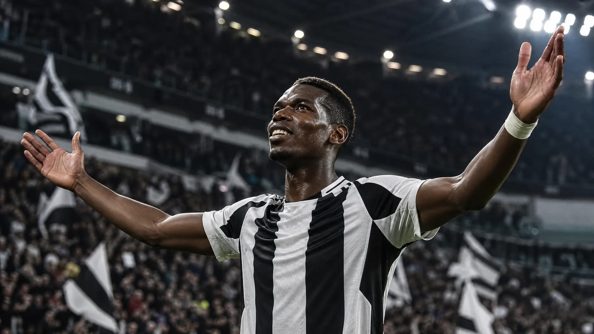 A striker celebrating in Juventus's iconic black and white kit as the club pursues Sorloth and Kolo Muani to replace Vlahovic