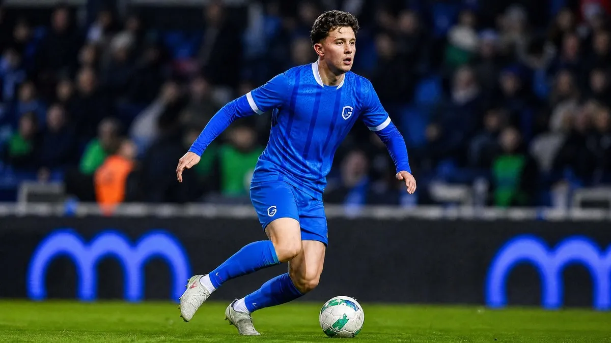 Konstantinos Karetsas dribbling in KRC Genk blue kit as PSG circle the Belgian midfielder with a €40m fee