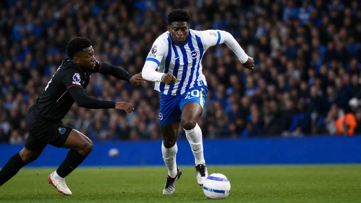 Carlos Baleba driving forward for Brighton and Hove Albion in the Premier League amid Manchester United transfer interest