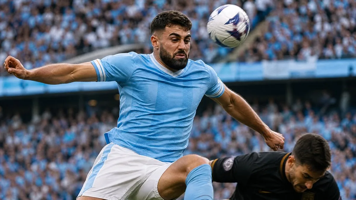 Josko Gvardiol in Manchester City sky blue kit winning an aerial duel in a Premier League match at the Etihad Stadium