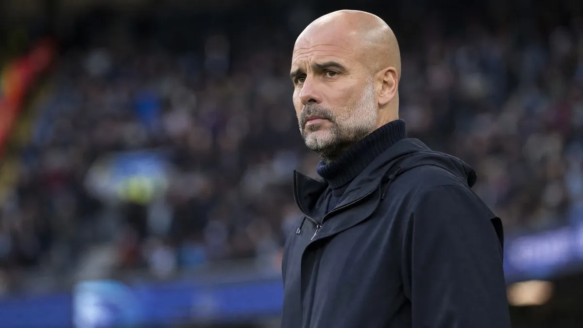 Pep Guardiola, Manchester City manager, looking pensive on the touchline amidst FFP charges investigation.