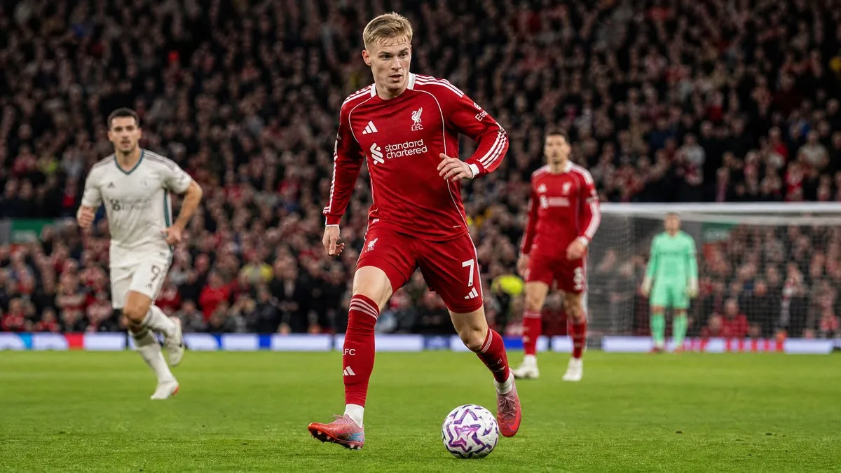 Florian Wirtz in action for Liverpool FC at Anfield during his debut Premier League season, driving through midfield